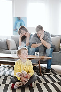 Helpless parents and their badly behaving son at home