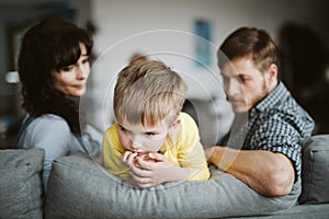 Helpless parents and their badly behaving son at home