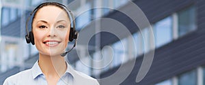 Helpline operator in headset over business center