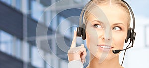 Helpline operator in headset over business center