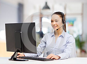 Helpline operator in headset working at office