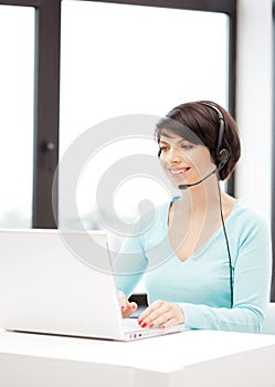 Helpline operator with laptop computer