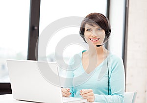 Helpline operator with laptop computer