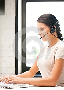 Helpline operator with laptop computer