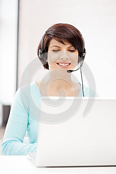 Helpline operator with laptop computer