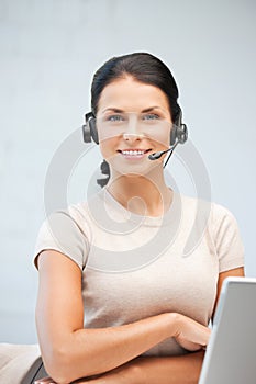 Helpline operator with laptop computer