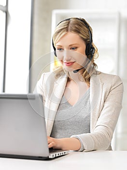 Helpline operator with laptop computer