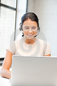 Helpline operator with laptop computer