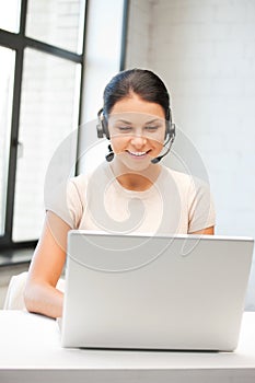 Helpline operator with laptop computer