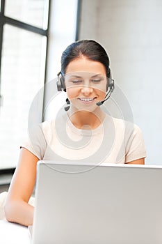 Helpline operator with laptop computer