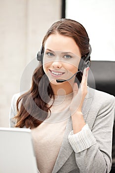 Helpline operator with laptop computer