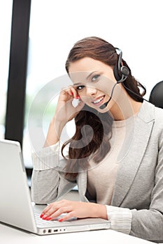 Helpline operator with laptop computer