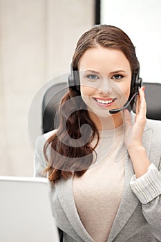 Helpline operator with laptop computer