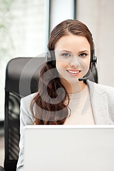 Helpline operator with laptop computer