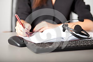 Helpline operator writing notes