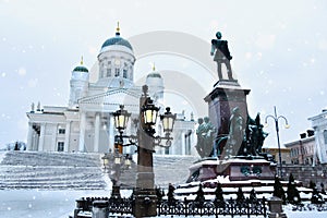 Tuomiokirkko Cathedral with statue of Alexander II in Helsinki, Finland photo