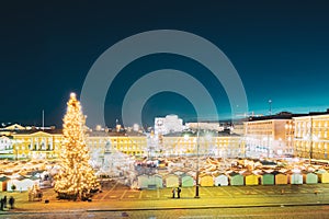 Helsinki, Finland. Christmas Xmas Market With Christmas Tree On Senate Square In Evening Night Illuminations