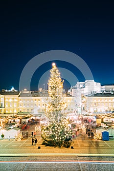 Helsinki, Finland. Christmas Xmas Market With Christmas Tree On Senate Square In Evening Night Illuminations.