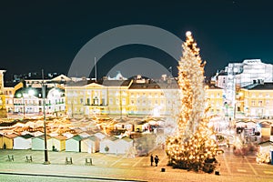 Helsinki, Finland. Christmas Xmas Market With Christmas Tree On Senate Square In Evening Night Illuminations.