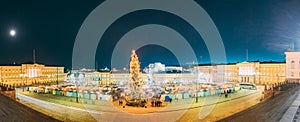 Helsinki, Finland. Christmas Xmas Market With Christmas Tree On Senate Square In Evening Night Illuminations. Panorama