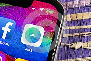 Facebook Ads application icon on Apple iPhone X screen close-up. Facebook Business app icon. Facebook Ads mobile application. Soci