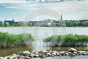 Helsinki, Finland - June 12, 2019: Toolo bay in the City Park in Helsinki, Finlandia Hall congress and event venue can be seen