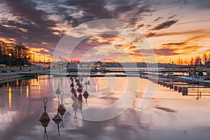 Helsinki, Finland. Landscape With City Pier, Jetty At Winter Sunrise Or Sunset Time. Tranquil Sea Water Surface At Early