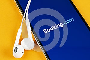 Booking.com application icon on Apple iPhone X screen close-up. Booking app icon. Booking.com. Social media app. Social network