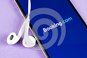 Booking.com application icon on Apple iPhone X screen close-up. Booking app icon. Booking.com. Social media app. Social network