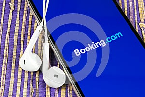 Booking.com application icon on Apple iPhone X screen close-up. Booking app icon. Booking.com. Social media app. Social network