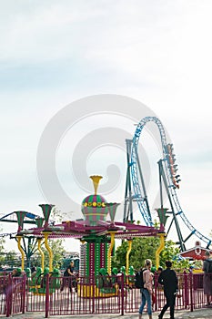 Helsinki, Finland - 21 May 2023: View of Linnanmaki amusement park with rides roller coaster Taiga and carousel Poppis