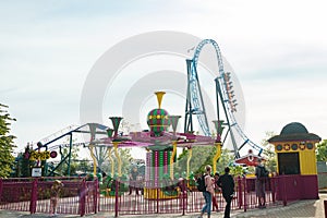 Helsinki, Finland - 21 May 2023: View of Linnanmaki amusement park with rides roller coaster Taiga and carousel Poppis