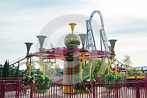 Helsinki, Finland - 21 May 2023: View of Linnanmaki amusement park with rides roller coaster Taiga and carousel Poppis