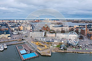 HELSINKI, FINLAND - NOVEMBER 2019: Helsinki. Finland. Ferris wheel in Helsinki. The embankment of the quay of Katajanokka. Uusimaa