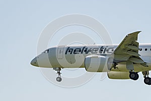 Helvetic Airways Embraer E-190-E2 jet landing on runway 14 in Zurich in Switzerland