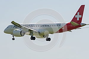 Helvetic Airways Embraer E-190-E2 jet landing on runway 14 in Zurich in Switzerland