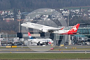 Helvetic airways Embraer E-190LR jet leaving from Zurich in Switzerland