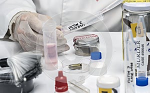 Hematological analysis with forensic test kit in a murder in a crime lab photo