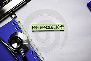 Hemorrhoidectomy text on top view  on white background. Healthcare/medical concept