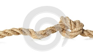 Hemp rope with knot on white background