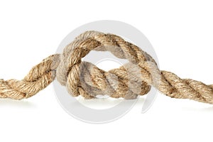 Hemp rope with knot on white background, closeup