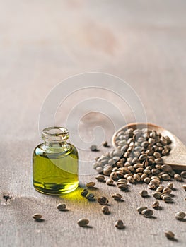 Hemp seeds and hemp oil, copy space. Vertical photo
