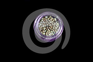 hemp seeds in a purple glass jar