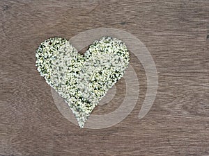 Hemp seeds shaped in heart symbol