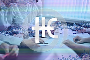 Hempcoin, THC cryptocurrency sign. The concept of business, cryptocurrency and finance - a team of businessmen are sitting in an