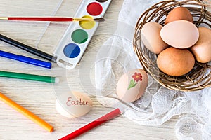 Hen`s eggs is prepared for painting with paints gouache and food markers for Easter.