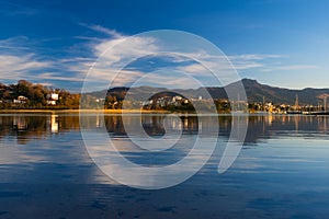 Hendaia is reflected in the water of the beach at sunset