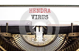 Hendra virus symbol. Concept words Hendra virus typed on white paper on old retro typewriter. Beautiful white background. Medical