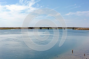 Henichesk Strait . View of the strait and the bridge connecting the two banks