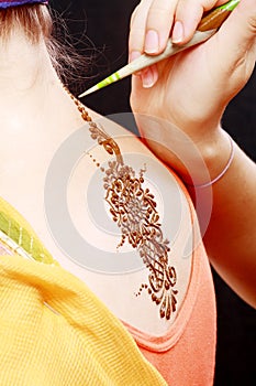 Henna applying on the back